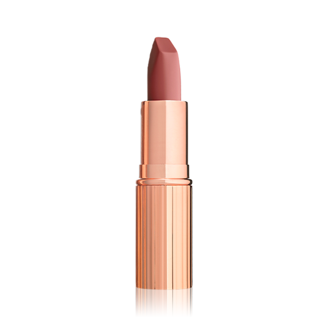 Matte Revolution in Rose Kiss open An open matte lipstick in a warm coral rose with a gold-coloured tube.
