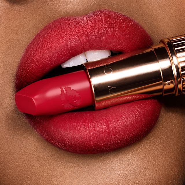 Carina's Love Lip close up Dark-haired model wearing Carina's Love bright red Hot Lips lipstick