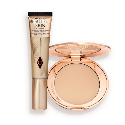 Charlotte's Beautiful Skin Complexion Kit displayed A foundation wand in gold packaging with a brown-beige-coloured body to show the shade of the foundation inside, and a pressed powder compact with a mirrored lid.