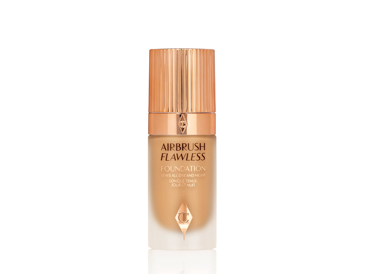 Airbrush Flawless Foundation in 9 Warm closed Foundation in a frosted glass bottle for medium-warm tones with a gold-coloured lid.