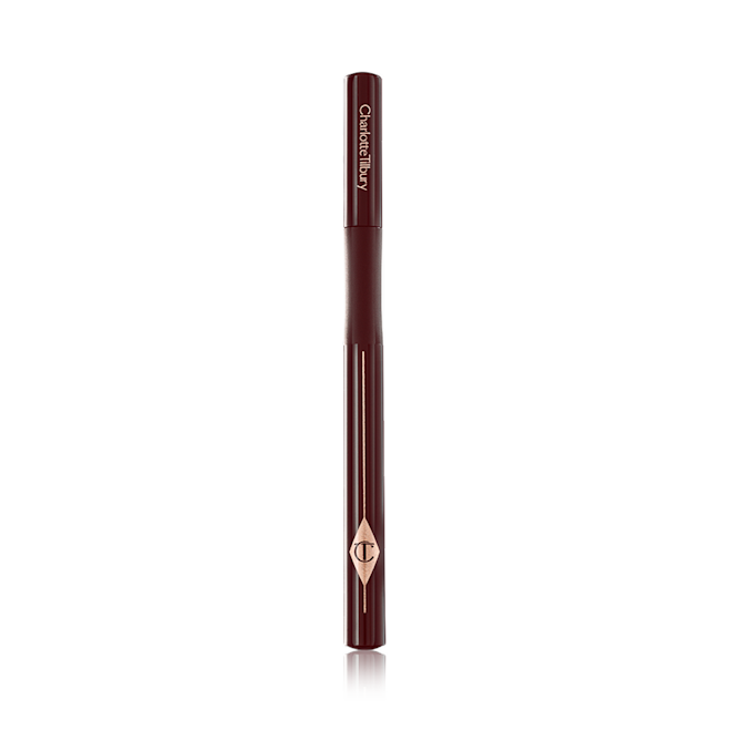 Feline Flick Super Brown Eyeliner closed A dark brown eyeliner pen with its lid closed and the CT symbol embossed on it.