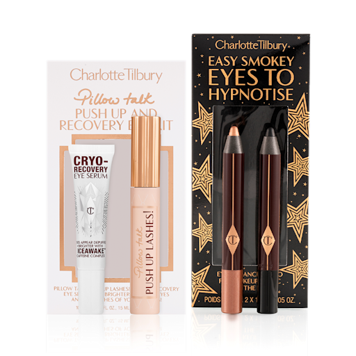 Smokey Eyes Dream Lashes Kit Eye serum in a white-coloured bottle, black mascara in a nude pink tube with a gold-coloured lid, and two chubby eyeshadow pencils in rose gold and black.