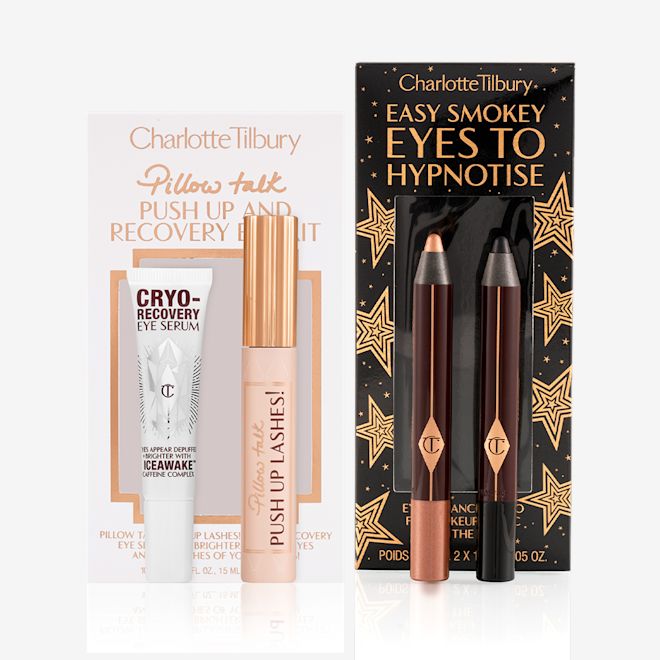 Smokey Eyes Dream Lashes Kit Eye serum in a white-coloured bottle, black mascara in a nude pink tube with a gold-coloured lid, and two chubby eyeshadow pencils in rose gold and black.