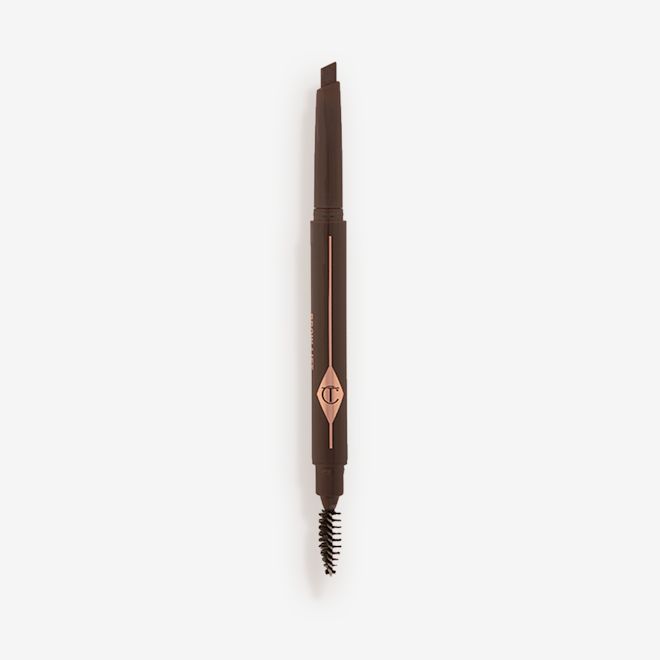 Brow Lift in Black Brown open An open, double-ended eyebrow pencil and spoolie brush duo in a black brown shade with black-brown-coloured packaging