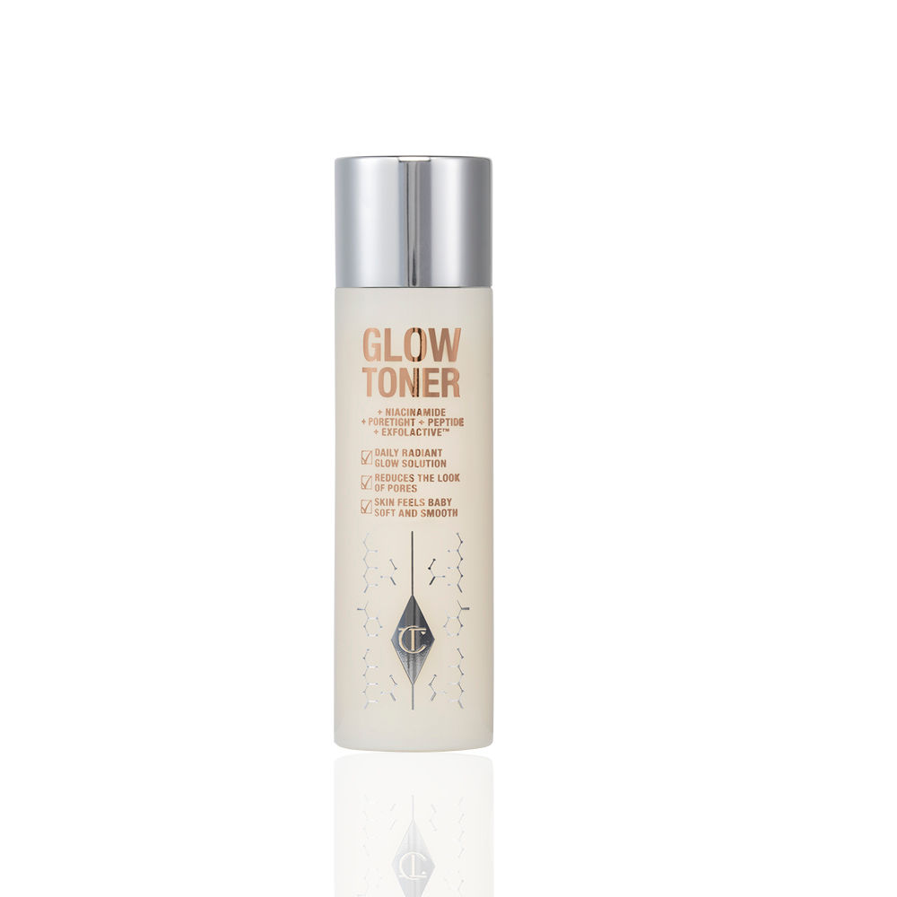 Glow Toner closed Glowy, cream-coloured toner in a large clear bottle with a silver-coloured lid.