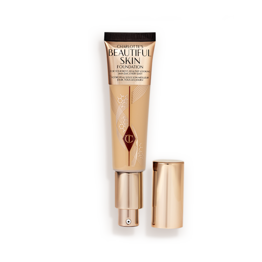 Beautiful Skin Foundation in Shade 10W open An open foundation wand in gold packaging with a pump dispenser and a dark-sandy-brown-coloured body to show the shade of the foundation inside.