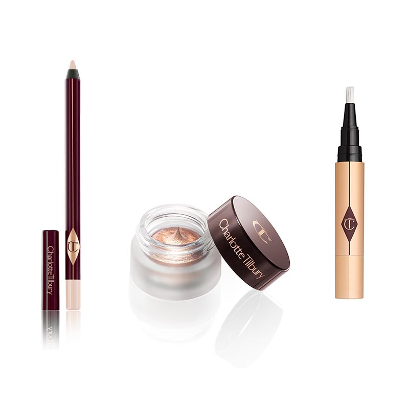 An open eyeliner pencil in a soft fawn colour with a shimmery copper cream eyeshadow, and an open concealer in golden-coloured packaging. 