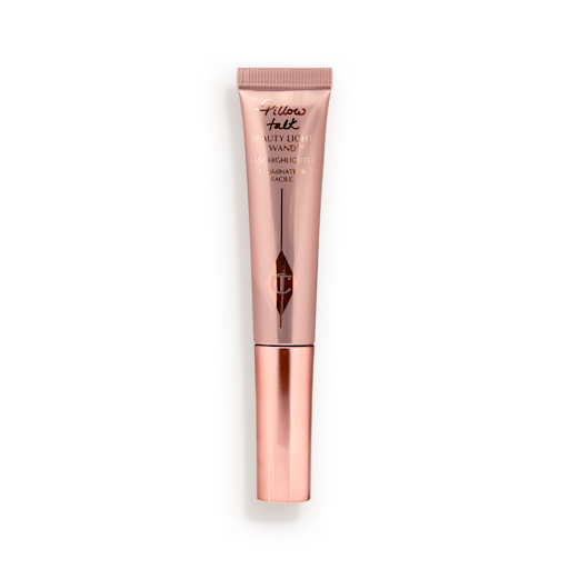 Beauty Light Wand highlighter in Pillow Talk Original Liquid highlighter wand in a reflective, pale pink tube with a rose gold cap.
