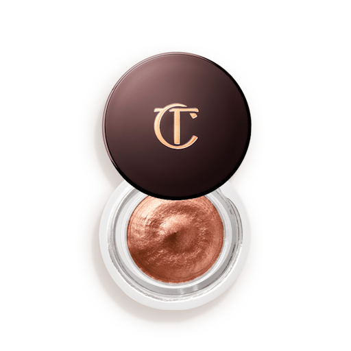 Eyes to Mesmerise in Walk of No Shame open An open glass pot with shimmery russet rose cream eyeshadow with golden-peach sparkle and its lid placed next to it.
