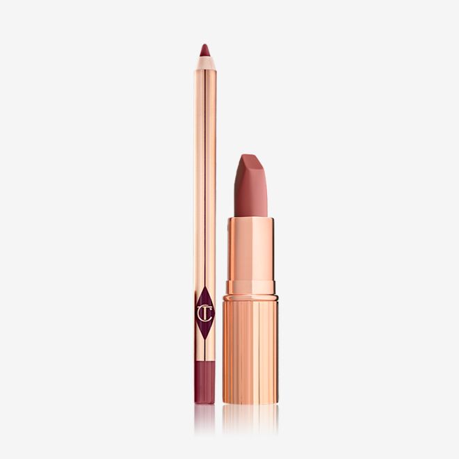 Luscious Lip Slick in Rose Kiss An open lipstick in a gold-coloured tube with a matching lip liner pencil, both in a medium-dark coral shade.