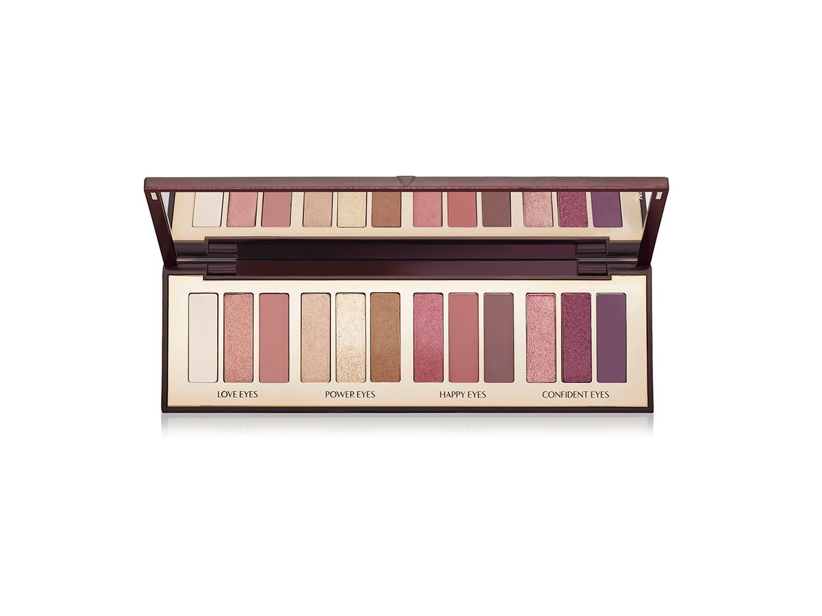 Instant Eye Palette in Stars in Your Eyes open An open, mirrored-lid eyeshadow palette in matte and shimmery brown, pink, gold, purple, and nude shades.