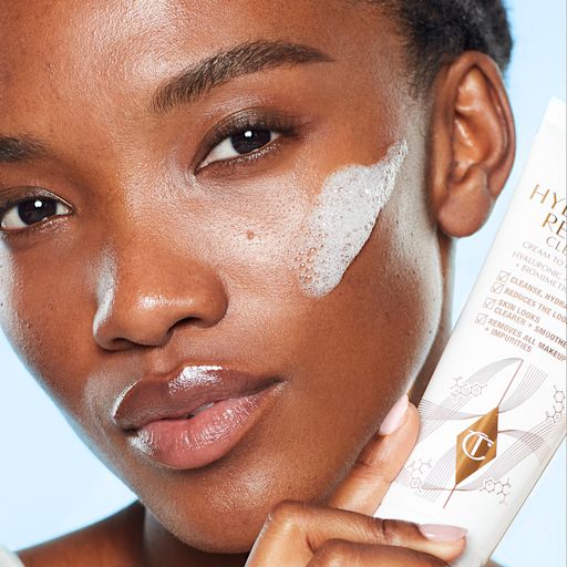 Mae skincare for oily skin Mae applying Charlotte's Magic Hydration Revival Cleanser in their skincare routine for oily skin