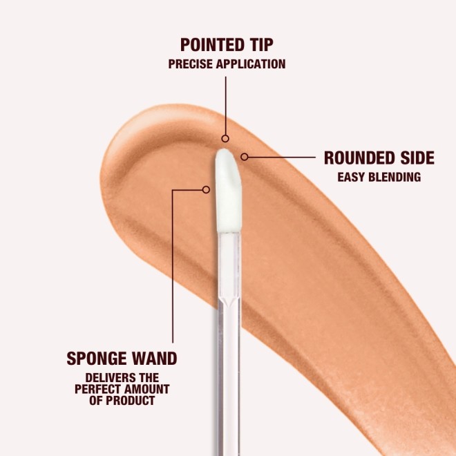 Close-up of a concealer applicator with a pointed tip for precise application, rounded side for easy blending, and sponge wand that delivers the perfect amount of product.