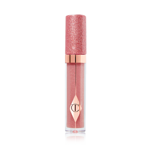 Jewel Lips in Pillow Talk closed A nude-pink lip gloss in a glass tube with a shimmery rose gold-coloured lid.
