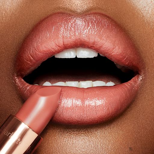 Bitch Perfect Lipstick deep model image Nude peach lipstick in Bitch Perfect on deep skin tone