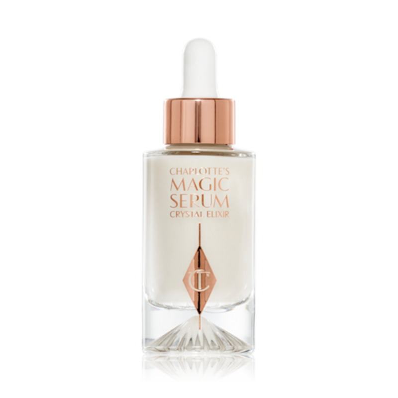 Magic Serum packshot for blog A luminous, ivory-coloured facial serum in a glass bottle with a white and gold-coloured dropper lid,