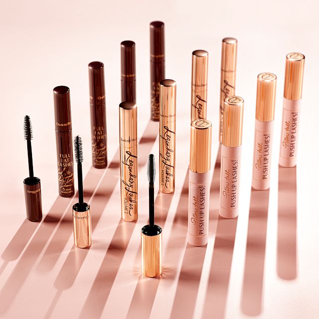 Full Fat Lashes, Legendary Lashes Volume 2 and Pillow Talk Push Up Lashes! mascara collection A collection of three different mascaras, one in dark crimson tube, the second in golden, and the third in a nude pink bottle with a gold-coloured lid. All three with their applicators in front of them.