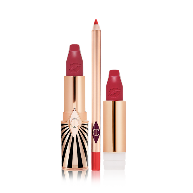 Hot Lips, Lipstick Refill and Lip Cheat Liner Kit open Lipstick in a dark, berry-pink shade with its refill next to it, both with lids removed, and a lip liner pencil in a bold, orange-red colour.