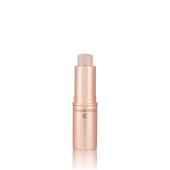 Quick & Easy Instant 5 Minute Kit in Chic Glow Highlighter open An open, highlighter stick in soft opal colour with a golden-coloured tube.