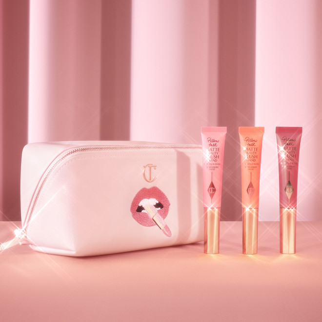 A makeup bag and three beauty blush wands