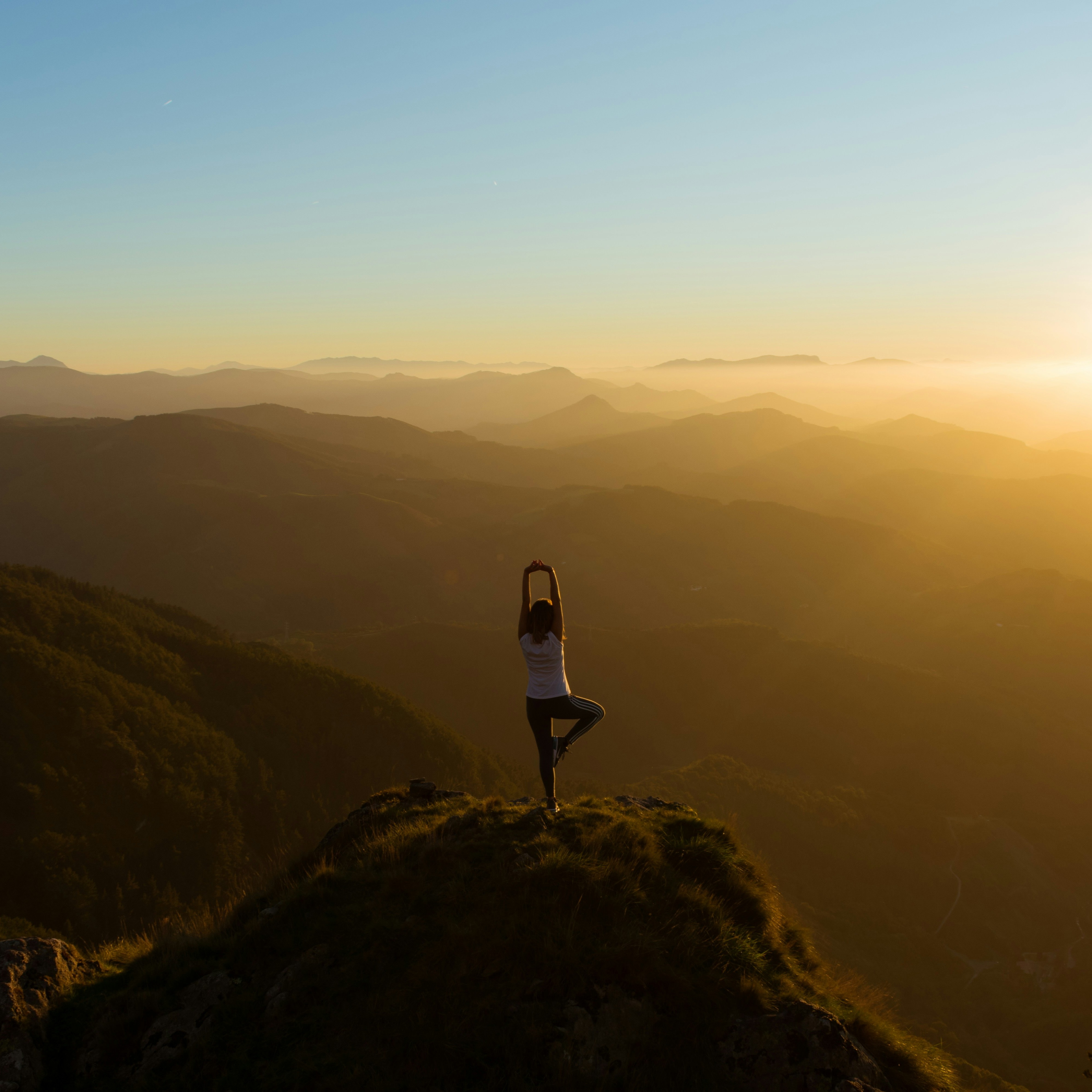 Yoga at the top of a mountain for stress awareness week.