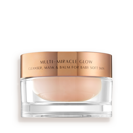 Multi Miracle Glow still life A 3-in-1 face fawn-coloured cleanser, mask, and balm in a glass jar with gold-coloured lid.