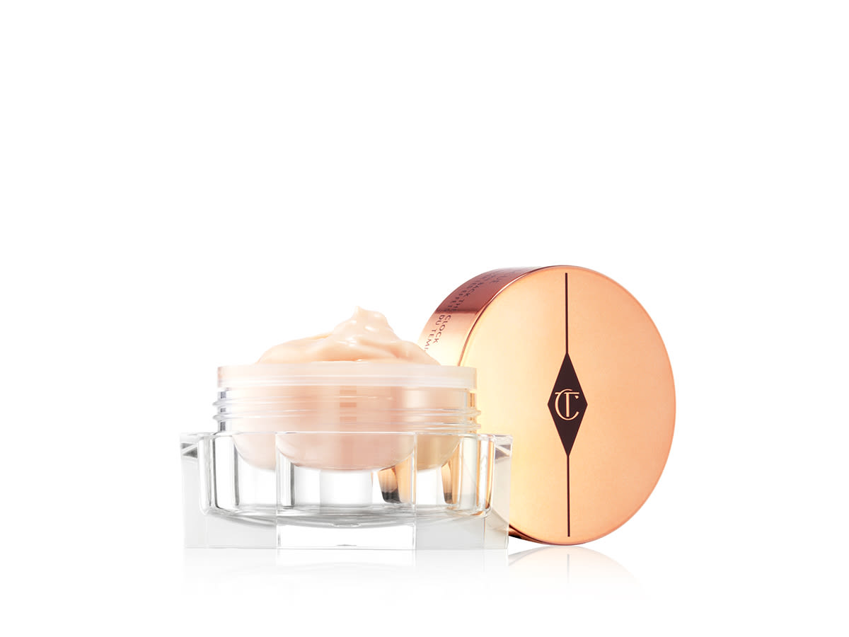 Magic Eye Rescue open A thick, champagne-coloured eye cream in a glass jar with a rose-gold coloured lid.