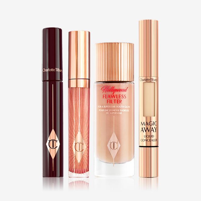 Flawless Glow & Plumper-Looking Lips Kit closed A mascara with a nude-pink lip gloss, a glow-boosting illuminating primer in a glass bottle, and a concealer with a small window on the tube that shows the colour of the concealer inside.