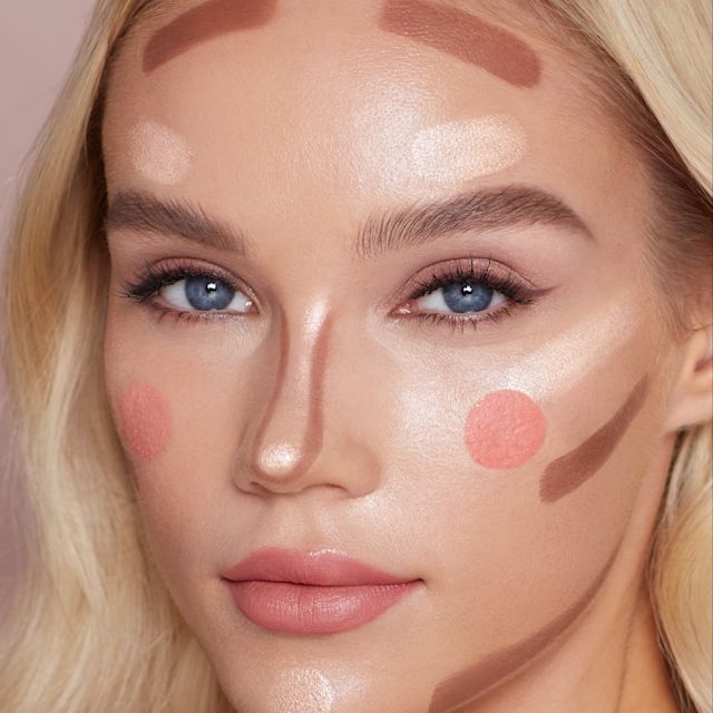 Beauty Wands application shot Model demonstrating the placements for Charlotte's liquid blush, blush-highlighter and contour wands