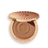 Beautiful Skin Sun-Kissed Glow Bronzer in Deep open Open, cream bronzer compact in a light-sandy-brown shade with gold-coloured packaging.