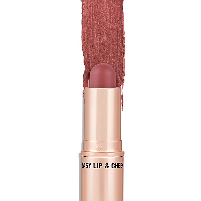Quick & Easy Instant 5 Minute Sun-Kissed Look lip and cheek stick open An open, lip and cheek colour stick in a glowy soft pink shade in a golden-coloured tube.
