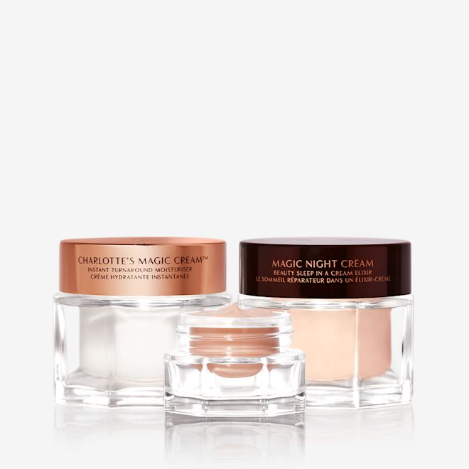 Magic Creams trio Banner with pearly-white face cream, fawn-coloured eye cream, and peach-coloured night cream in glass jars with sleek lids.