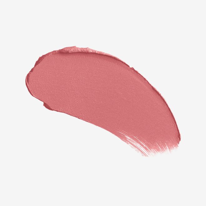 K.I.S.S.I.N.G. Lipstick in Blushing Dream swatch Swatch of a warm coral rosebud lipstick with a satin-finish.