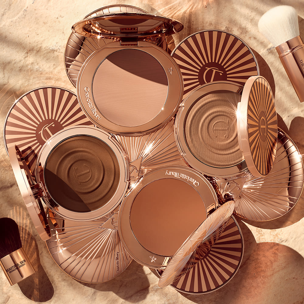 Bronzer still life 4 shades of Charlotte's cream and powder bronzers for lightly sculpting the look of your face