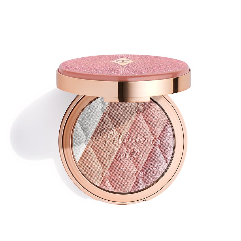 Pillow Talk Multi-Glow highlighter in Romance Light open An open, pressed powder highlighter compact, with a mirrored-lid, in various shades of pink and gold for cool-tone complexions.