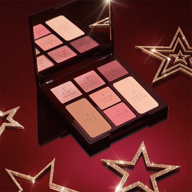 Mesmerising 5-minute Makeup Kit open An open, face palette with a mirrored lid with nude brown and pink eyeshadows, two pink blushes, and a bronzer and highlighter.