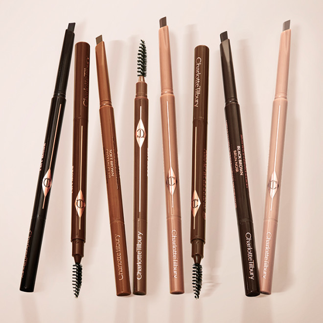 A collection of double-ended eyebrow pencils and eyebrow brushes in shades of black, black-brown, light brown, medium brown, soft brown, dark brown, taupe, and light blonde.