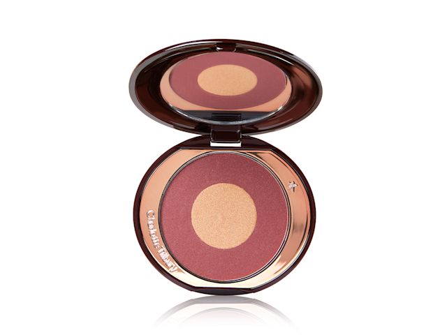 Cheek To Chic in Walk of No Shame open An open, two-tone powder blush compact in berry-pink and honey gold shades.