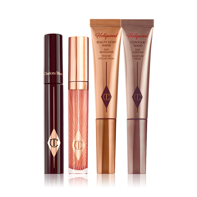 Contour Glow Makeup Kit closed A mascara with a nude pink lip gloss and two highlighter wands in light gold and bronze-coloured packaging.