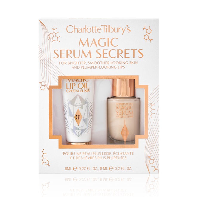Magic Serum Secrets packed Travel-size lip oil in a white-coloured tube with a gold-coloured lid and a mini, glow-enhancing serum in a glass bottle with a gold and white-coloured dropper lid packed in their gift sleeve in white colour with the text, 'Magic serum secrets' written on it'.