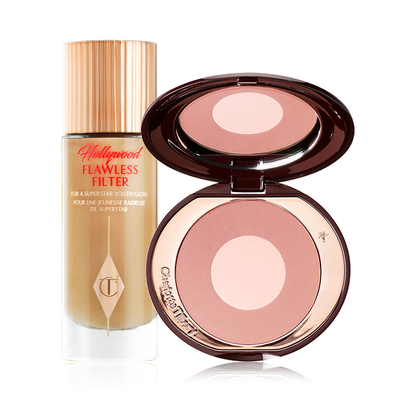Dewy, Pretty Blushed Cheeks Kit displayed Glowy primer in a glass bottle with a sleek, gold-coloured lid and two-tone blush compact in a rose gold and champagne shade with a mirrored-lid.