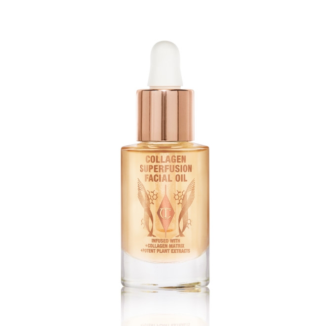 Travel-size light-gold-coloured facial oil in a glass bottle with a gold and white-coloured dropper lid.