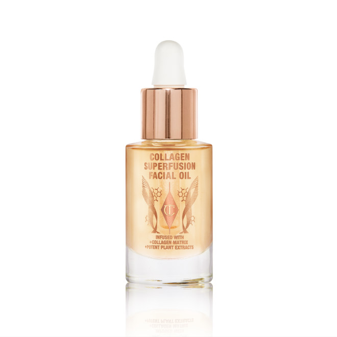 Travel-size light-gold-coloured facial oil in a glass bottle with a gold and white-coloured dropper lid.