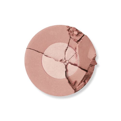 Swatch of a two-tone powder blush in a nude pink shade. 