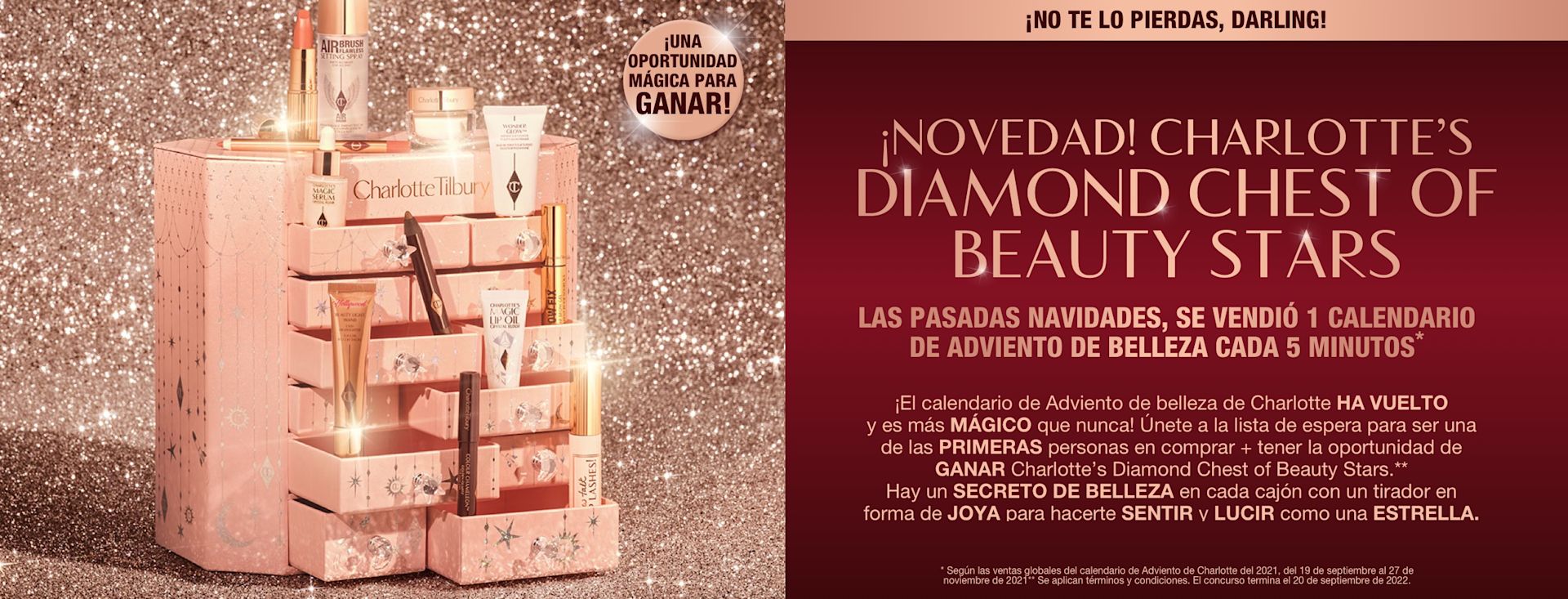 ES HOLIDAY22-ADVENT-CONTENT-HERO-MB A pink-coloured chest of drawers with a clay mask, nude pink matte lipstick, nude pink lip liner, eyeliner pencil in dark copper, black-coloured mascara, liquid primer, champagne-coloured liquid highlighter, dark brown eyeliner pencil, pearly-white face cream, luminous ivory-coloured serum, and bronze-coloured body highlighter., and text that reads, 'A magical chance to win!'