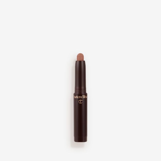 Quick & Easy Instant 5 Minute Kit Eyeshadow Stick in Super Chic open An open cream eyeshadow wand in a cool, nudey-brown matte shade in black-coloured tube.