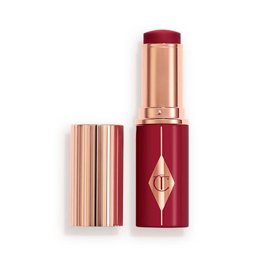 Unreal Blush Berry Glow Open Berry packaging matching to the stick product with a rose gold lid and detailing.