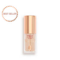 Mini Hollywood Flawless Filter in shade 2 closed A closed glow-boosting primer in a glass bottle with a rose gold-coloured lid.