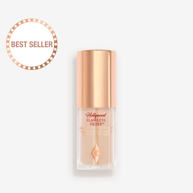 Mini Hollywood Flawless Filter in shade 2 closed A closed glow-boosting primer in a glass bottle with a rose gold-coloured lid.