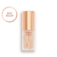 Mini Hollywood Flawless Filter in shade 2 closed A closed glow-boosting primer in a glass bottle with a rose gold-coloured lid.